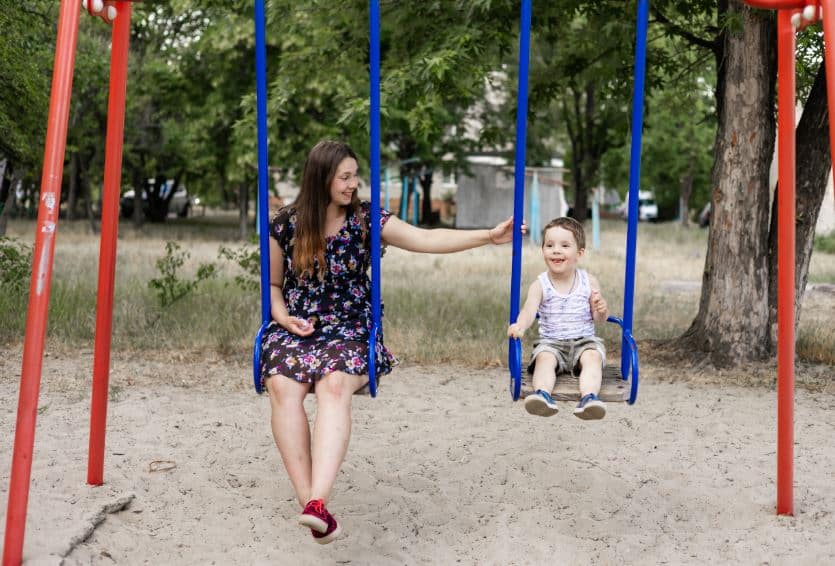 Mother and son on a swing